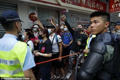 معترضان هنگ كنگی در جشن ملی چین، سیاه پوش شدند